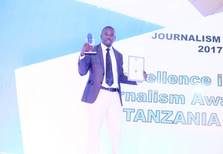 Calvin Gwabara Holding trohies