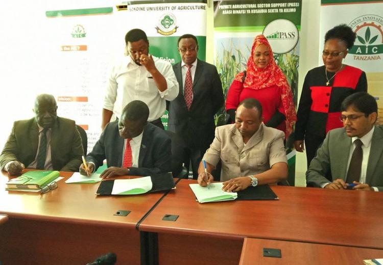 Vice Chancellor of Sokoine University of Agriculture Prof.Raphael T. Chibunda (Left) and PASS Dorector Mr. Nicomed Bohay (Right) signing the partnership agreement between the two institutions at Sokoine University of Agriculture