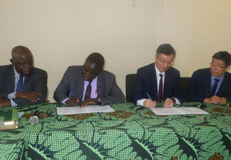 Sokoine University of Agriculture (SUA) Vice Chancellor Prof. Raphael Chibunda (Second left) and the President of China Agricultural University Prof. SUN QIXIN signing partnership agreement between the two universities