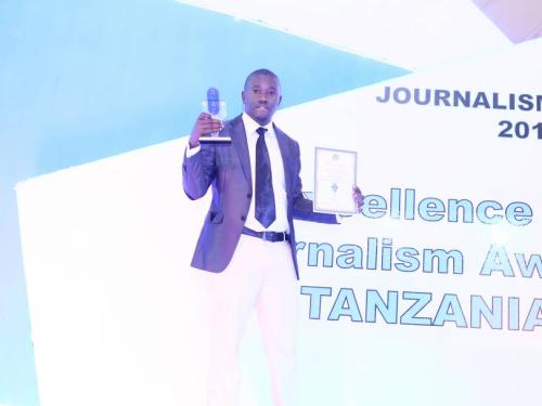 Calvin Gwabara Holding trohies