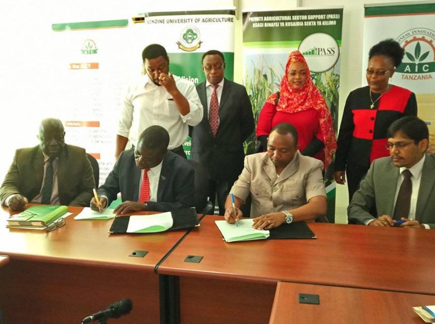 Vice Chancellor of Sokoine University of Agriculture Prof.Raphael T. Chibunda (Left) and PASS Dorector Mr. Nicomed Bohay (Right) signing the partnership agreement between the two institutions at Sokoine University of Agriculture